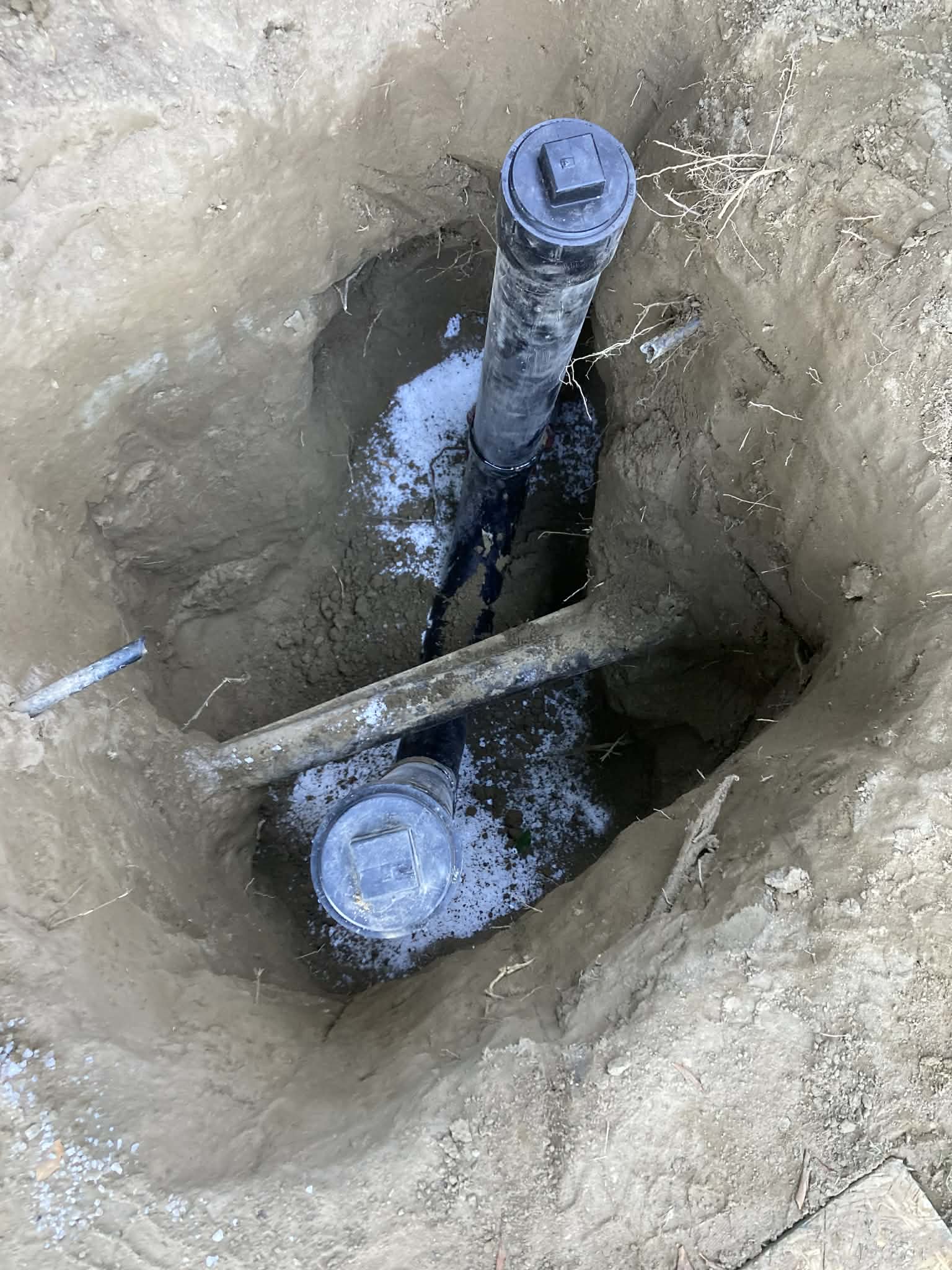 Underground sewer line installation with new pipe fittings