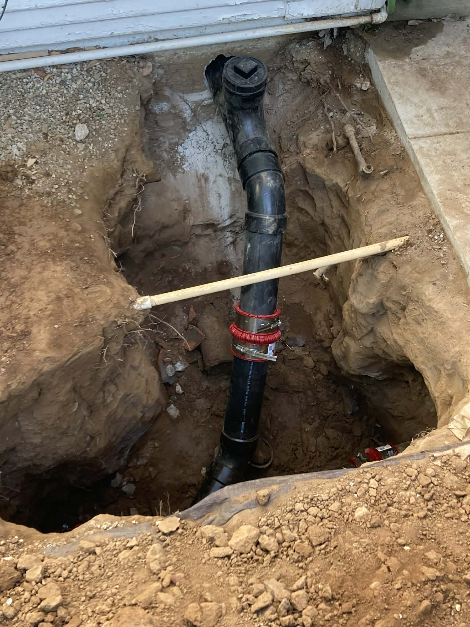 Underground sewer line replacement with new ABS pipe