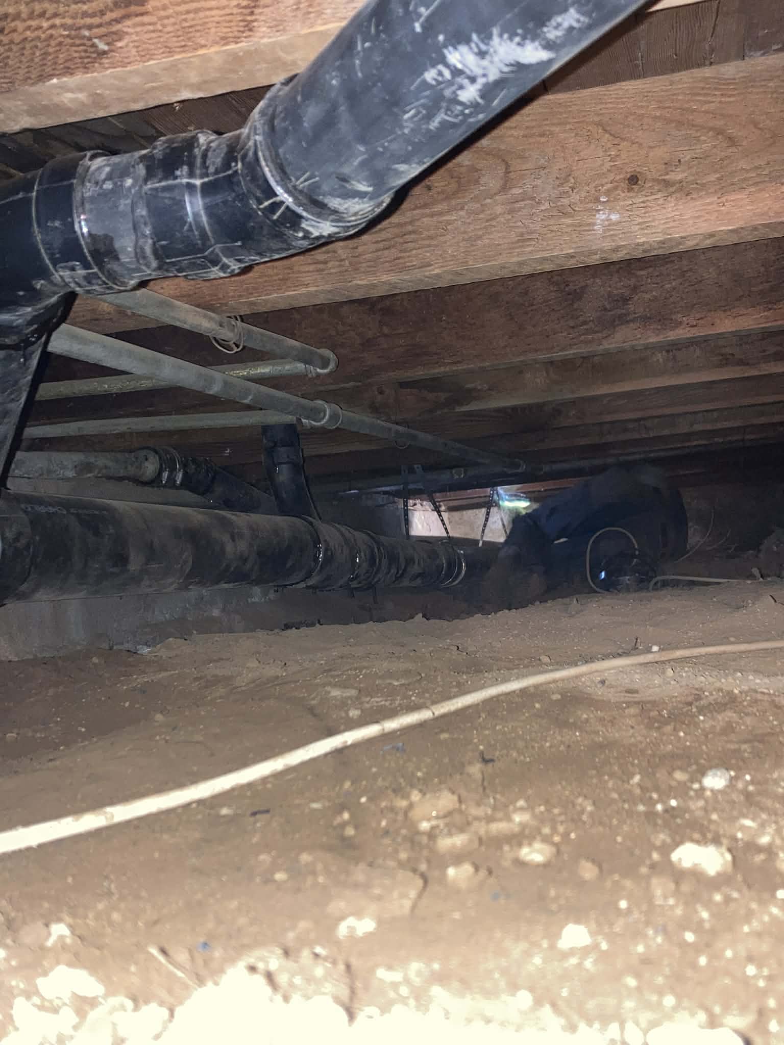 Crawl space drain line installation with proper support